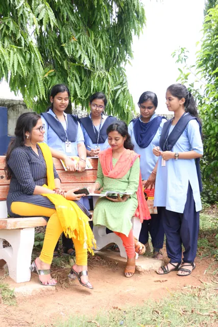 A group of students seated together in the campus garden.