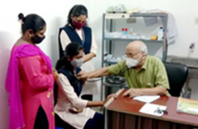 A doctor checking a student’s health at the campus medical room.